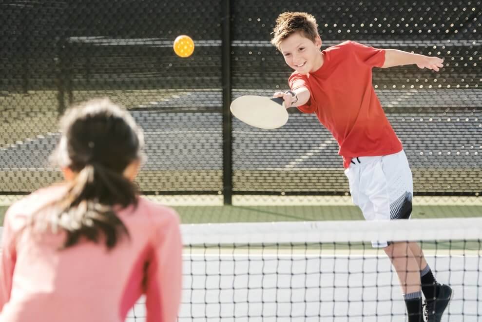 kids playing pickleball