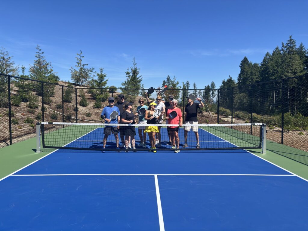 group of pickleball players on a pickleball court